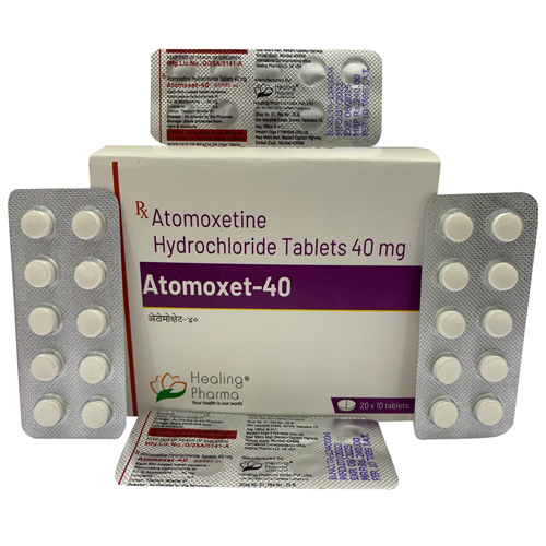 Atomoxet 40mg white box with purple label alongside silver blister packs