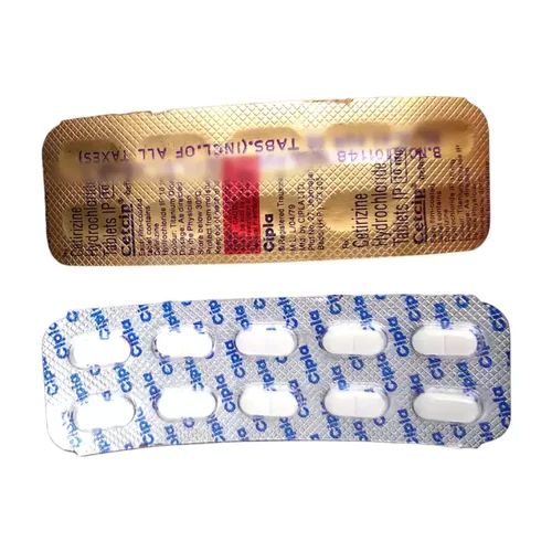 Cetcip 10 tablets 10mg close-up of golden and silver foil blister strips with round tablets