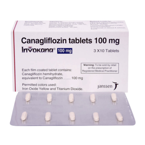 Invokana 100mg box with blister strip placed beside, tablets and packaging legible