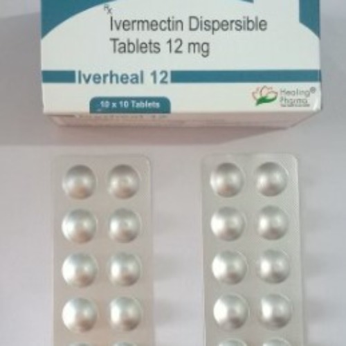 Iverheal 12mg (Ivermectin) close-up of multiple silver blister packs containing white round tablets