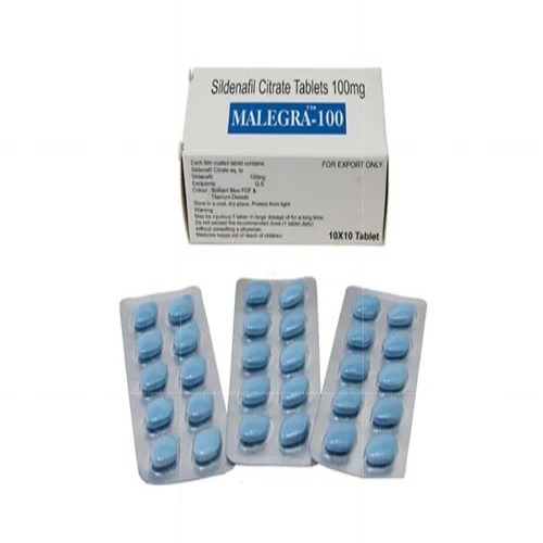 Malegra 100mg blister packs arranged in front – men’s health Viagra alternative from online pharmacy