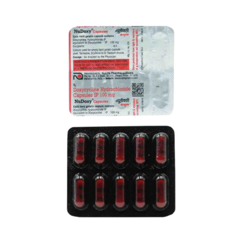 Nudoxy 100 blister close-up showing brown tablets and printed foil