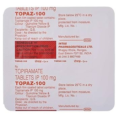 Close-up of Topaz 100 blister strip, tablet imprints and printed info readable
