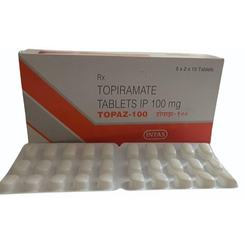 Topaz 100 box and blister arranged flat, angled/top-down view with label and tablet count visible