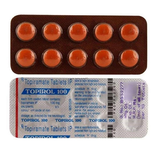 Topirol 100 blister strip close-up showing orange tablets and foil backing with printed info