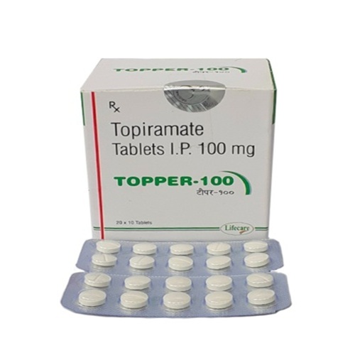Topper 100 blister strip close-up showing white tablets and foil backing, imprint readable